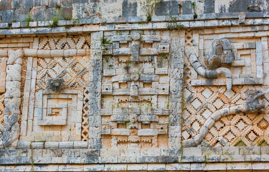 Ancient wall with carved Mayan  ornament , Uxmal, Yucatan, Mexico. UNESCO world heritage site